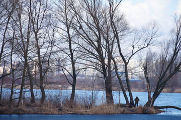 Mature caucasian man walking in the forest with backpack