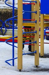 Children play on the playground in the winter on a holiday Maslenitsa