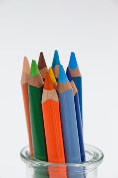 Close-up of colored pencils kept in a glass jar