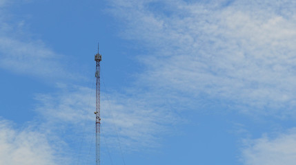 Telecommunication tower against blue sky
