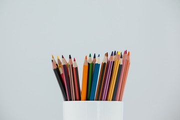 Colored pencils kept in cup
