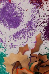 Sharpener and various colored pencil shavings