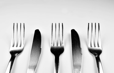 Forks and Knives isolated on bright background
