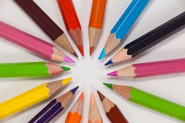 Fototapeta premium Close-up of colored pencils arranged in a circle