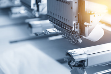 The industry sewing machine in the light blue scene with lighting effect