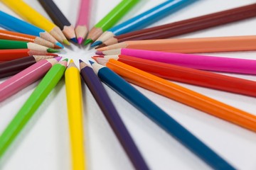 Fototapeta premium Close-up of colored pencils arranged in a circle