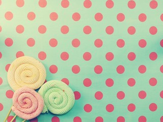 marshmallow lollipop on polka dot background