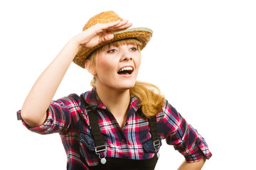 Woman wearing sun hat looking at something