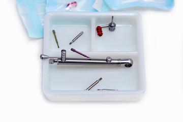 Dental implant  tools in a white pkastic box