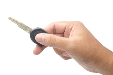 Hand holding key isolated on white background