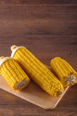 boiled corn on cut board
