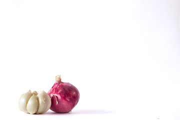Onions and garlic are placed on a white background,front view,copy space