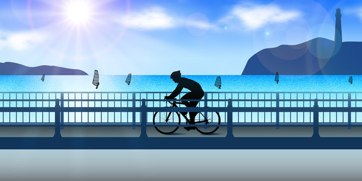 海沿いの道路でロードバイクに乗る男性