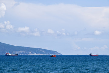 Ships on the horizon of the sea. Out at sea ships