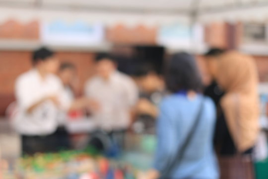 Blurred image of education people looking at the Exhibition in the university. - Powered by Adobe