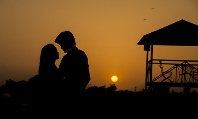 Fototapeta na wymiar Couple Love in Sunset Evening