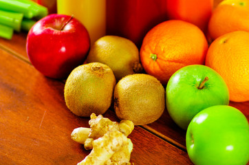 Selection of delicious fruits and vegetables spread out on wooden surface, beautiful colors, healthy lifestyle concept