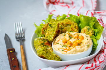 Bright green falafel with hummus. Love for a healthy vegan food concept