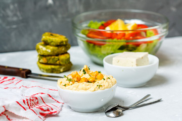 Vegan lunch: falafel, tofu, salad and hummus. Love for a healthy vegan food concept