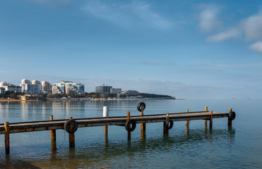 The berth of the rescue station against the background of the sea bay and the cape
