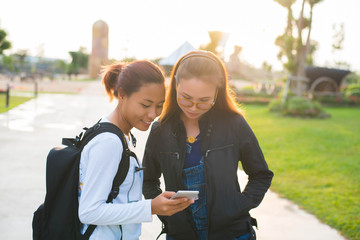  a happy woman reading text message on mobile phone