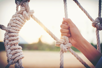 hand caught  rope tied in a knot for adventure.