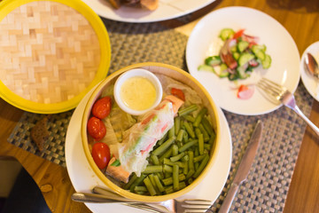 Fish with vegetables in a couple in a restaurant