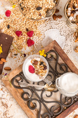 Obraz na płótnie Canvas Granola, yogurt, nuts and berries
