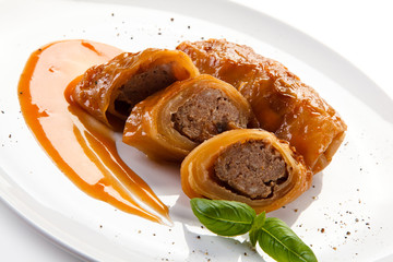 Wrapped meat with tomato sauce