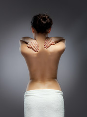 Woman massaging back pain