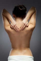 Fototapeta premium Woman massaging back pain