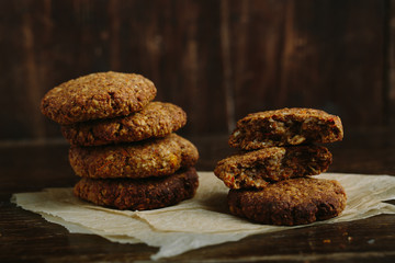 pile of oat cookies on wooden table