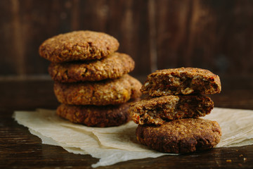 pile of oat cookies on wooden table