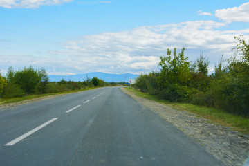 Mountain road. The landscape of fields and mountains