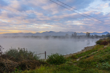 Lake in the mountains for recreation and fishing. Early morning