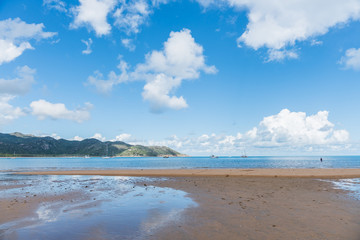 Boats in Horseshoe Bay at low tide on tropical Magnetic Island, Australia