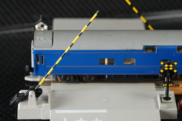 The miniature model of level crossing represent the train toy and miniature model concept related idea.