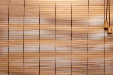Texture wood blinds stitched rope. Identical strips of wood, thin.