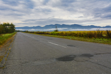 Mountain road. The landscape of fields and mountains