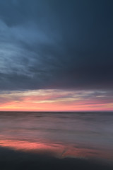 sunrise on the water / Early summer morning bright sky Beach