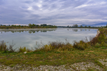 Lake in the mountains for recreation and fishing. Early morning