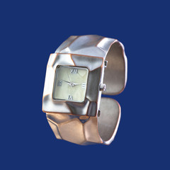 Ladies wrist watches isolated on blue 