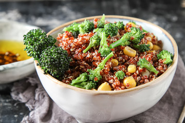Quinoa salad with broccoli and corn. The concept of superfoods. Selective focus. Dark background.