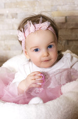 baby holding an egg for Easter