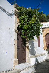 Fototapeta na wymiar LINDOS, RHODES, GREECE: Doors in antique town