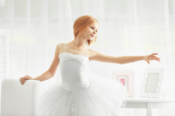 Fototapeta premium Small ballerina dancer at home