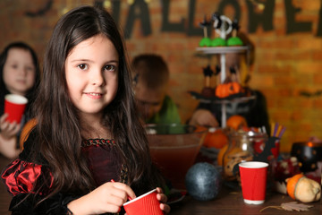 Cute girl in costume on Halloween party