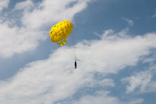 Parasailing in a blue sky