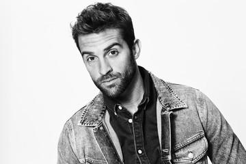 Portrait of man in denim jacket, studio