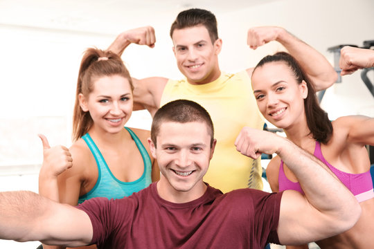 Group of people taking selfie in gym